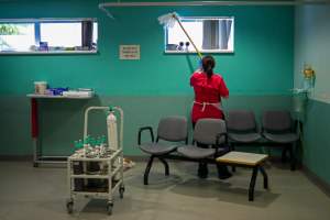 A cleaner working in a UK hospital in 2020 in the early stages of the country's pandemic. Photo: Hannah McKay/Reuters/Bloomberg via Getty Images