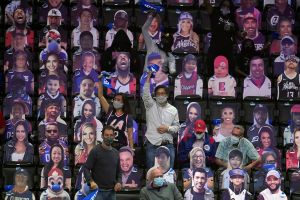 Fans cheer among cardboard cutouts during the COVID-19 pandemic, before Game 2 of an NBA basketball first-round playoff series between the Los Angeles Clippers and the Dallas Mavericks on Tuesday, May 25, 2021, in Los Angeles.