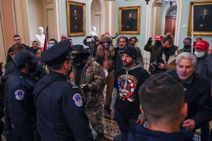 Doug Jensen protests against US Capitol police officers as they try to stop supporters of US President Donald Trump from entering the Capitol on January 6, 2021, in Washington, DC. (Photo by Saul LOEB / AFP) (Photo by SAUL LOEB/AFP via Getty Images)