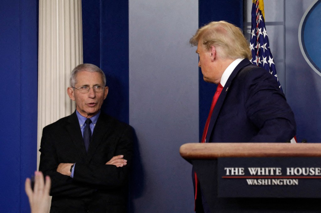 File photo dated March 26, 2020 of Director of the National Institute of Allergy and Infectious Diseases Dr. Anthony Fauci talks to U.S. President Donald Trump in Washington, DC, USA.