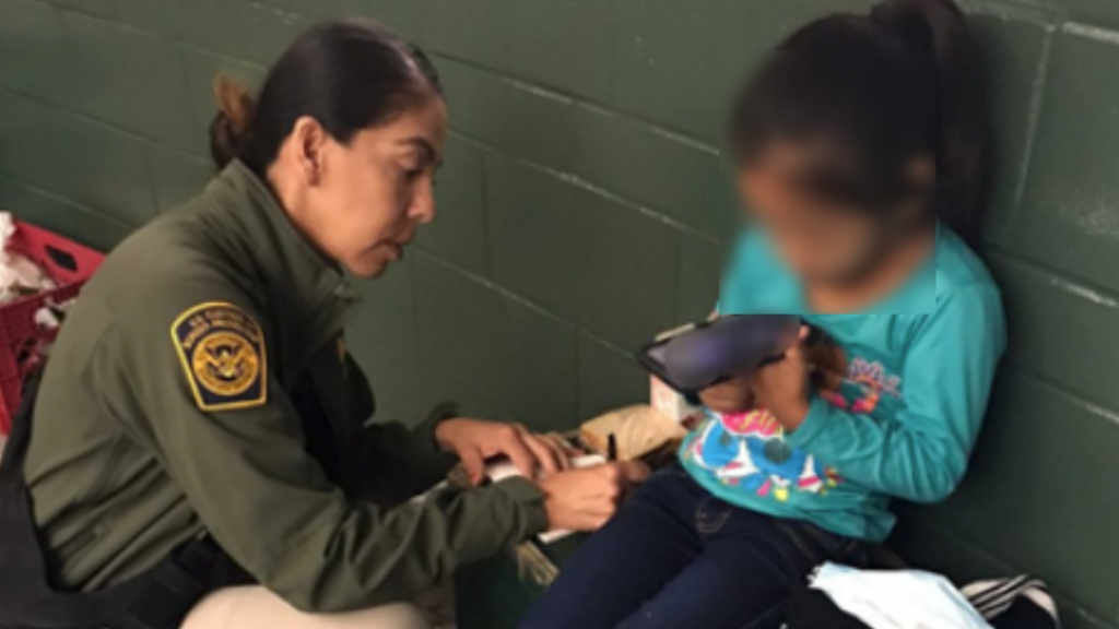 A photo of the 5-year-old girl with her face blurred found wandering alone near the U.S-Mexico border wall.