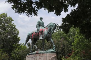 A statue of Confederate General Robert E. Lee is covered in red paint Sunday, June 28, 2020 in Charlottesville, Va.