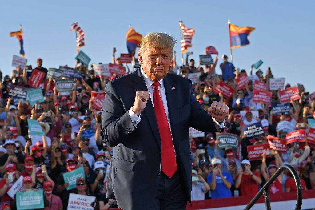 US President Donald Trump dances as he leaves a rally at Tucson International Airport in Tucson, Arizona on October 19, 2020. (MANDEL NGAN / AFP) (Photo by MANDEL NGAN/AFP via Getty Images)