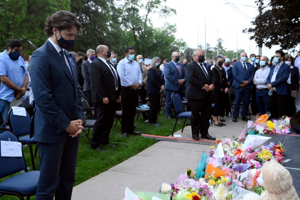 Prime Minister Justin Trudeau looks on during moment of silence at a vigil for the victims of the deadly vehicle attack on five members of the Canadian Muslim community in London, Ont., on Tuesday, June 8, 2021.