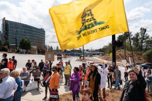 People are seen at a protest against masks, vaccines, and vaccine passports outside the headquarters of the Centers for Disease Control (CDC) on March 13, 2021 in Atlanta, Georgia.