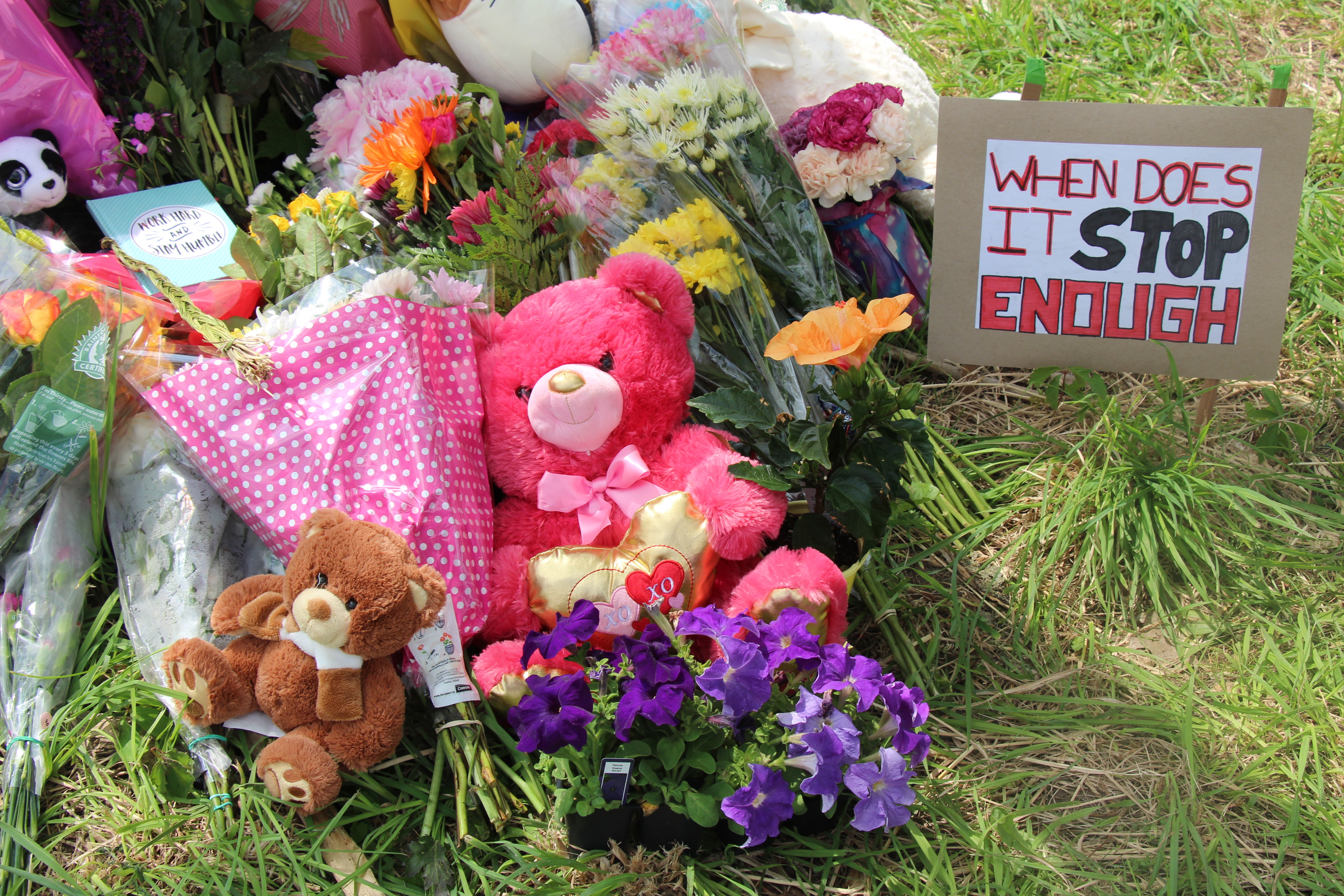 Flowers are placed during a memorial ceremony at the location where a family of five was hit by a driver in London, Ontario, Canada on June 08, 2021. Four of the members of the family died and one is in critical condition. A 20 year old male has been charged with four counts of first degree murder and count of attempted murder in connection with the crime. (Photo by Seyit Aydogan/Anadolu Agency via Getty Images)