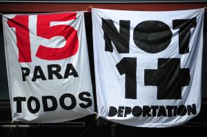 A banner displayed on Casa Latina in Seattle calls for $15 an hour for all ahead of the May Day immigrant and workers rights march on May 1, 2014.