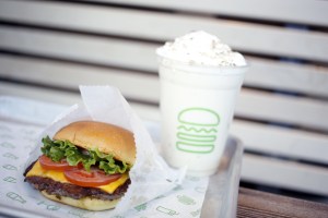 A ShackBurger and milkshake are arranged for a photograph at a Shake Shack Inc. restaurant.