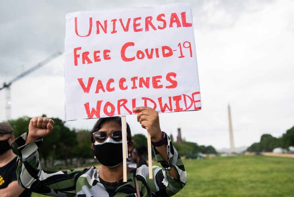 Demonstrators hold a rally to "Free the Vaccine," calling on the US to commit to a global coronavirus vaccination plan that includes sharing vaccine formulas with the world to help ensure that every nation has access to a vaccine, on the National Mall in