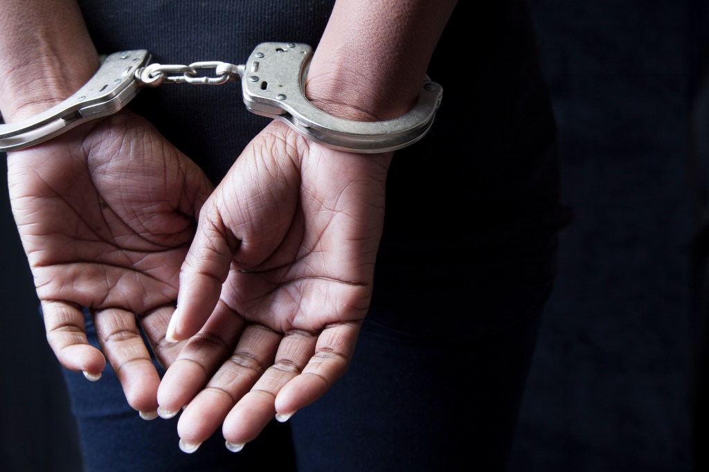 Woman in handcuffs (Bill Oxford/Getty Images)