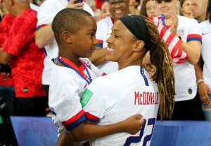 Jessica McDonald of the USA celebrates with her son on June 28, 2019 in Paris, France. (Photo by Maddie Meyer.