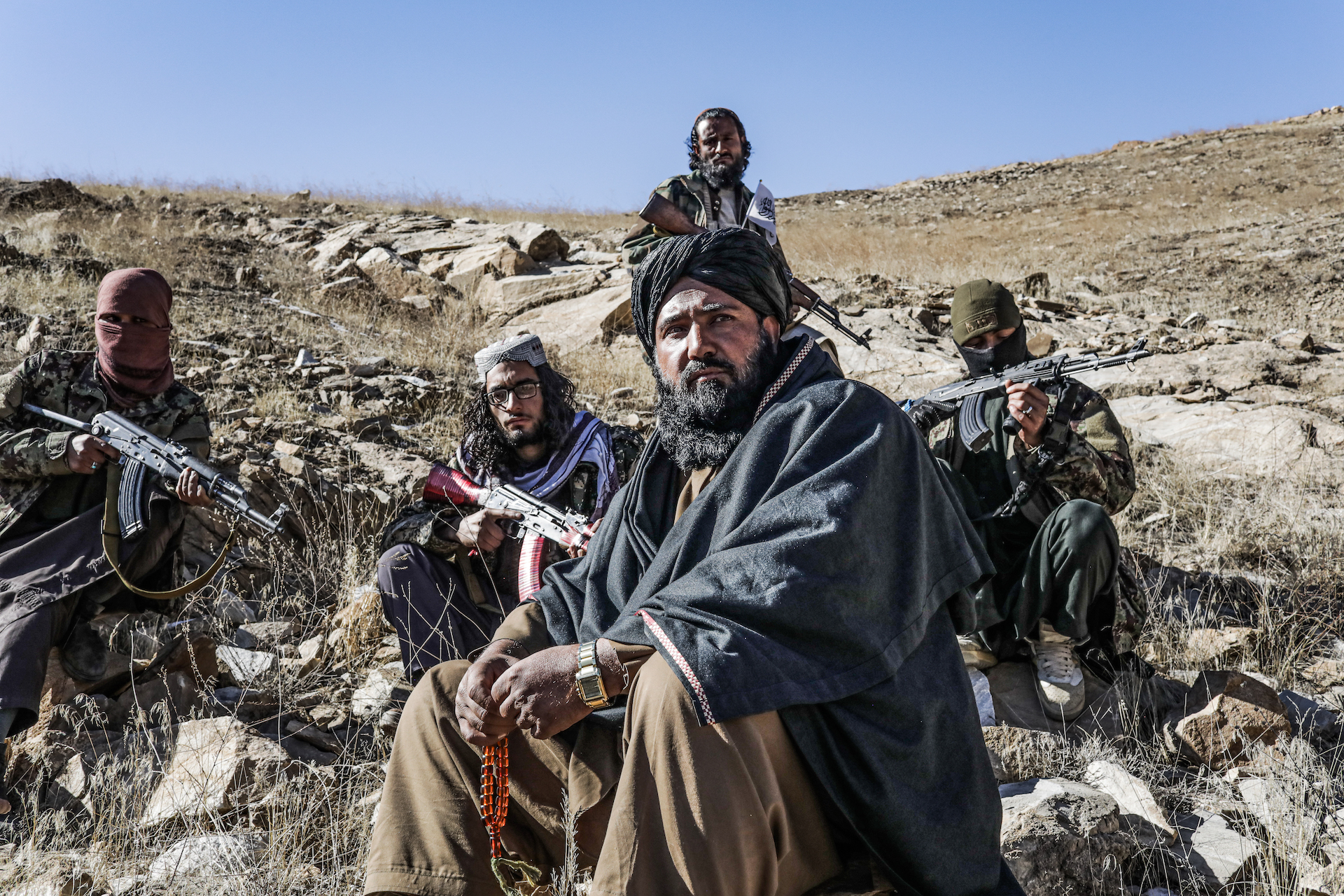 Commander Hamas, who leads a unit of about 20 fighters in Wardak Province, sits down for an interview on a mountain top overlooking the Tangi Valley. (Photo: Adam Desiderio/VICE News)