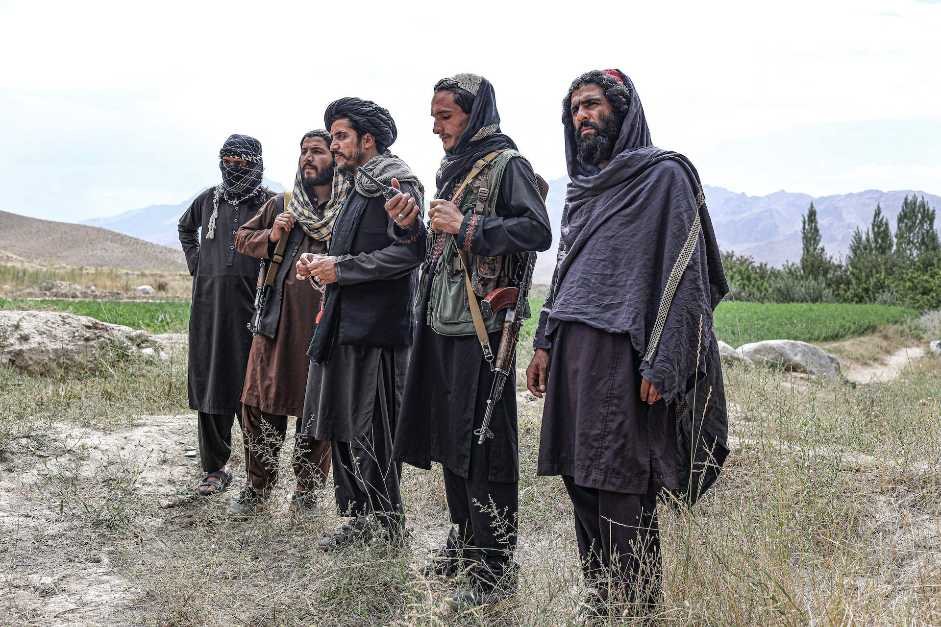 Commander Khatab (center) stands for an interview alongside other Taliban fighters in Wardak Province. (Photo: Adam Desiderio/VICE News)