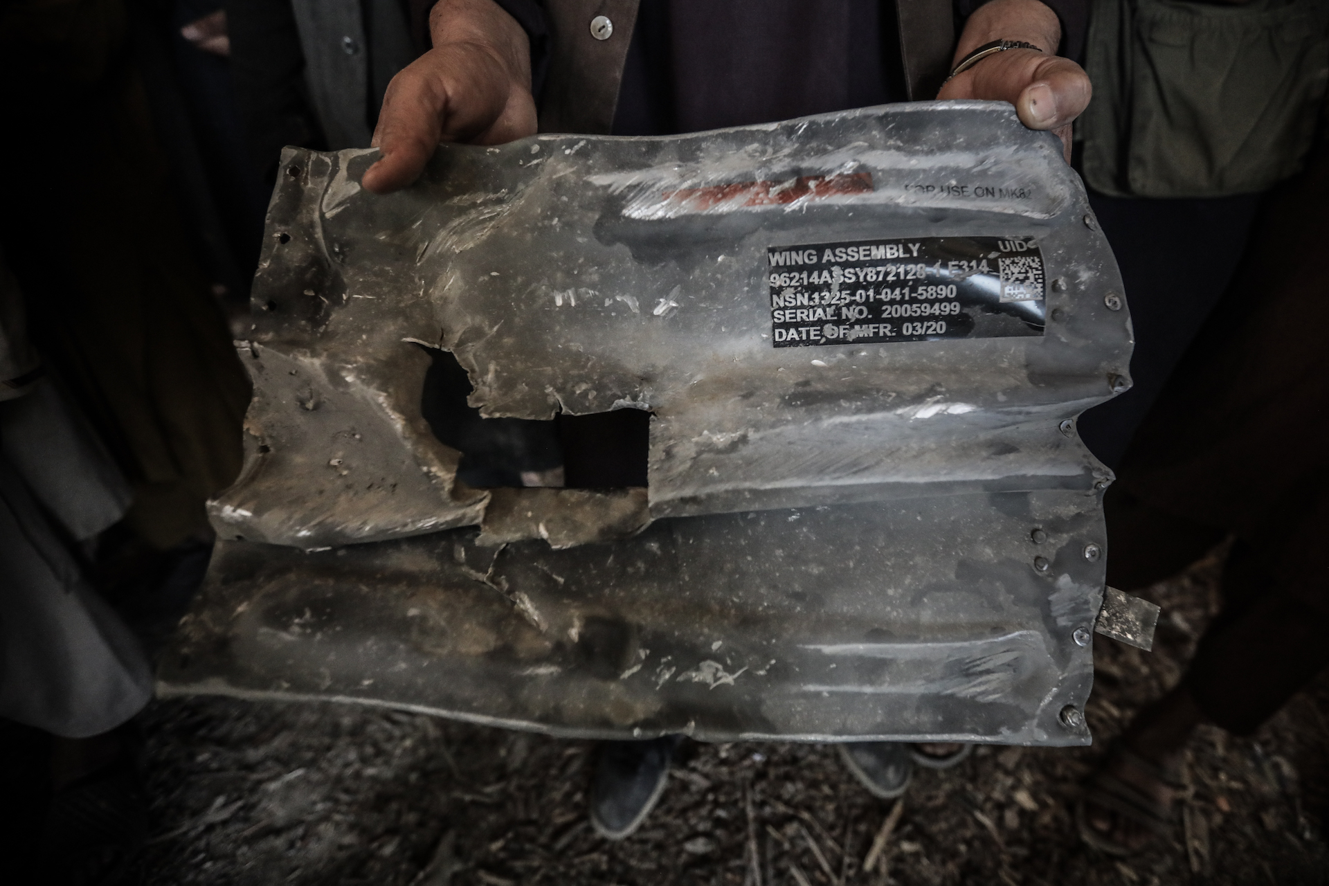 Safiullah, 28, a resident of Mali Khel village in Wardak Province, holds a piece of shrapnel from a U.S.-made GBU-12 laser-guided bomb that allegedly destroyed a local mosque. (Photo: Adam Desiderio/VICE News)