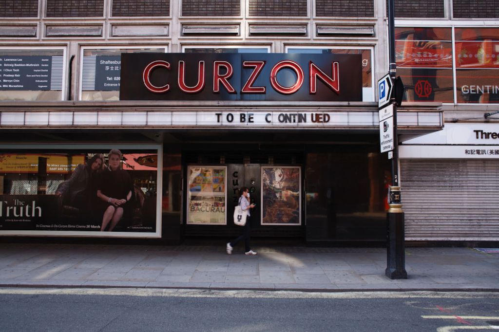 A person walks past Curzon cinema in London.