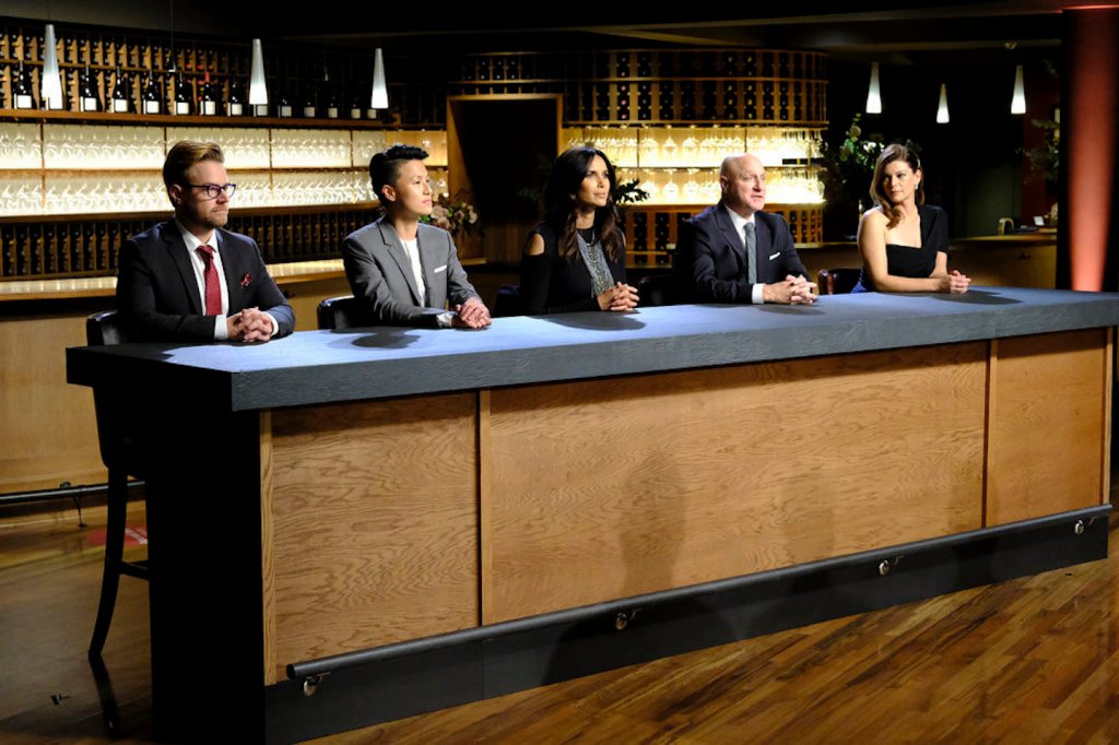 a still image from Top Chef season 18 in Portland, Oregon showing (l-r) Richard Blais, Melissa King, Padma Lakshmi, Tom Colicchio, Gail Simmons