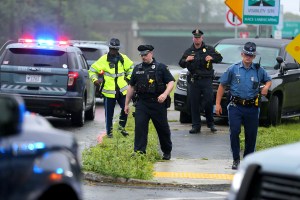 State Police and Stoneham Police set up a roadblock on Main Street at the entrance to Rt 95(128) North during a standoff was taking place on the highway with police and armed men in Stoneham, Massachusetts, on July 3, 2021.