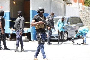 Members of the Haitian police and forensics look for evidence outside of the presidential residence on July 7, 2021 in Port-au-Prince, Haiti.