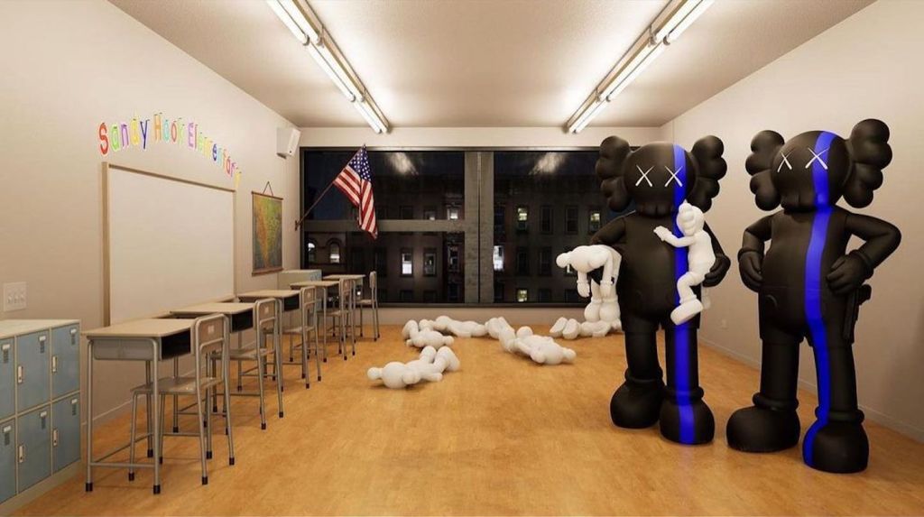 Two black and blue statues stand in an empty classroom holding white humanoid figures.