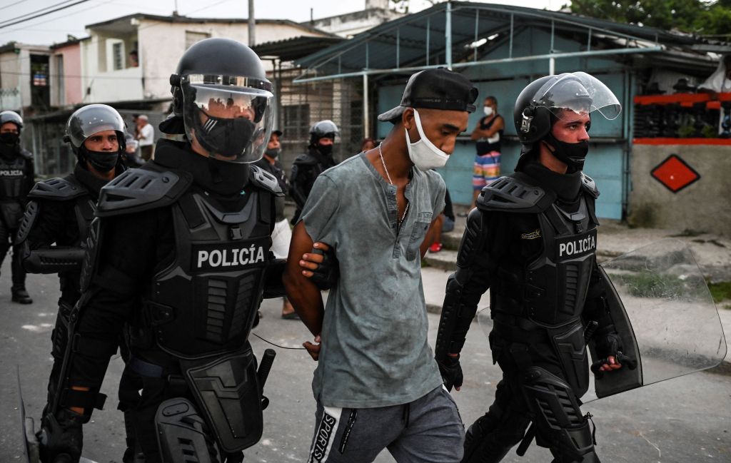 A man is arrested during a demonstration against the government of President Miguel Diaz-Canel in Arroyo Naranjo Municipality, Havana on July 12, 2021. (Photo by YAMIL LAGE / AFP) (Photo by YAMIL LAGE/AFP via Getty Images)