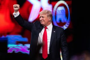 Former US President Donald Trump pumps his fist as he walks off after speaking at the Conservative Political Action Conference in Dallas, Texas on July 11, 2021.