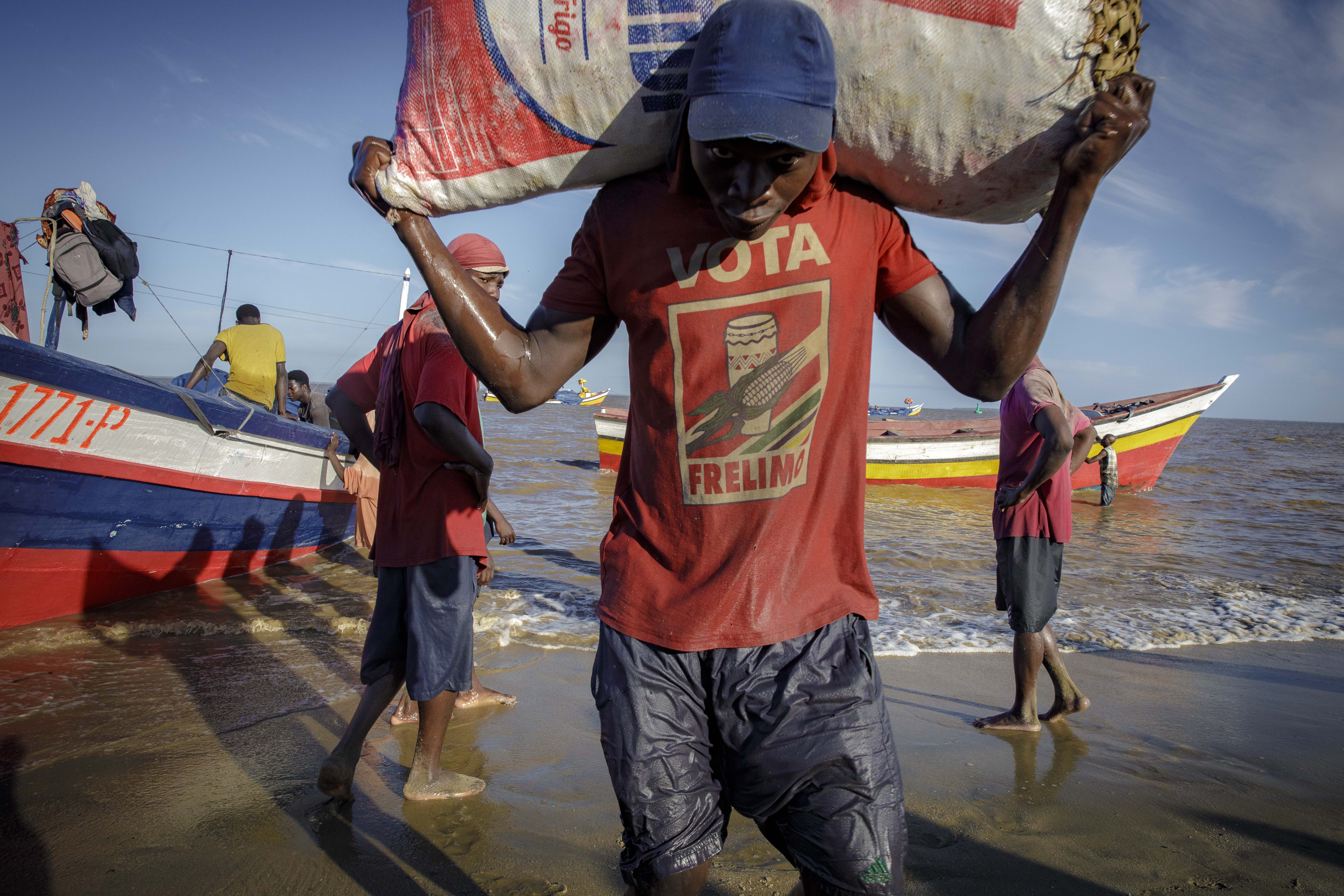 Fishermen and informal workers start their day in at Praia Nova in Beira, central Mozambique.