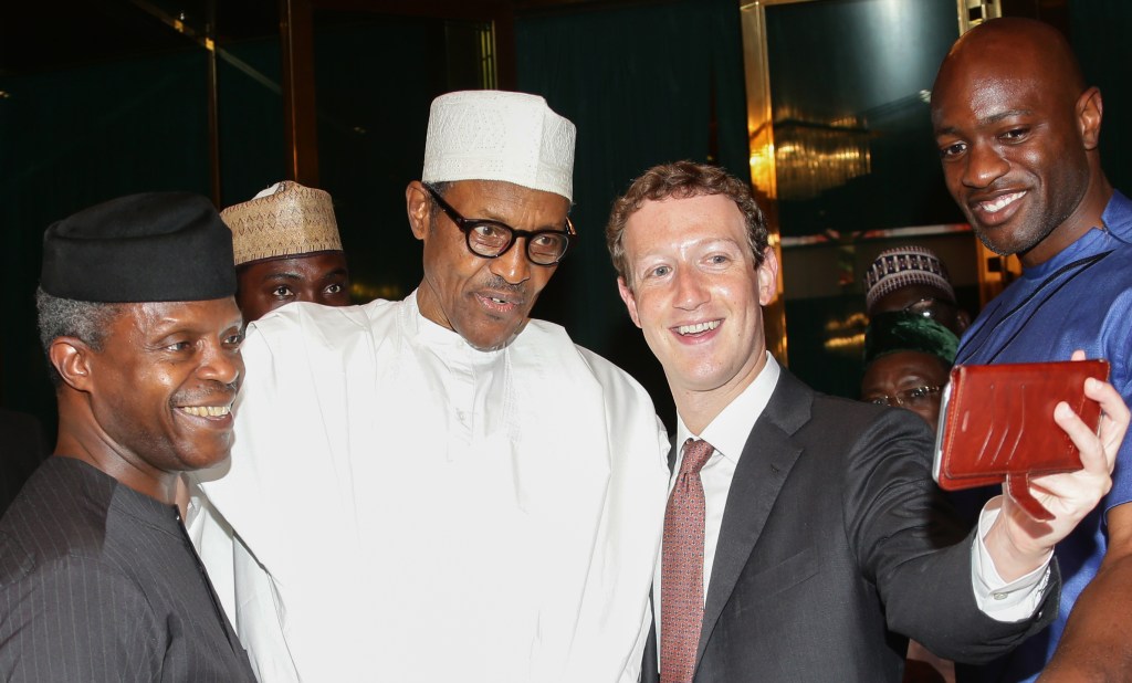 President Muhammadu Buhari poses with Facebook founder Mark Zuckerberg during a visit to the presidential palace in Abuja, on September 2, 2016.