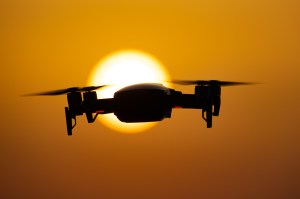 A quadcopter drone hovering during a flight in front of the sun. ​A similar devices was recently discovered being used to smuggle drugs into a prison in Chile.