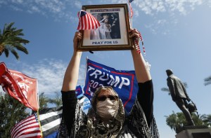 A supporter of President Donald Trump demonstrates at a ‘Stop the Steal’ rally in front of the State Capitol on November 7, 2020 in Phoenix, Arizona. (Mario Tama/Getty Images)​