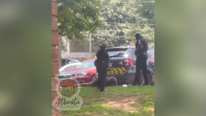 ​Screenshot of bystander video showing an Atlanta Police sergeant kicking a handcuffed woman in the face.