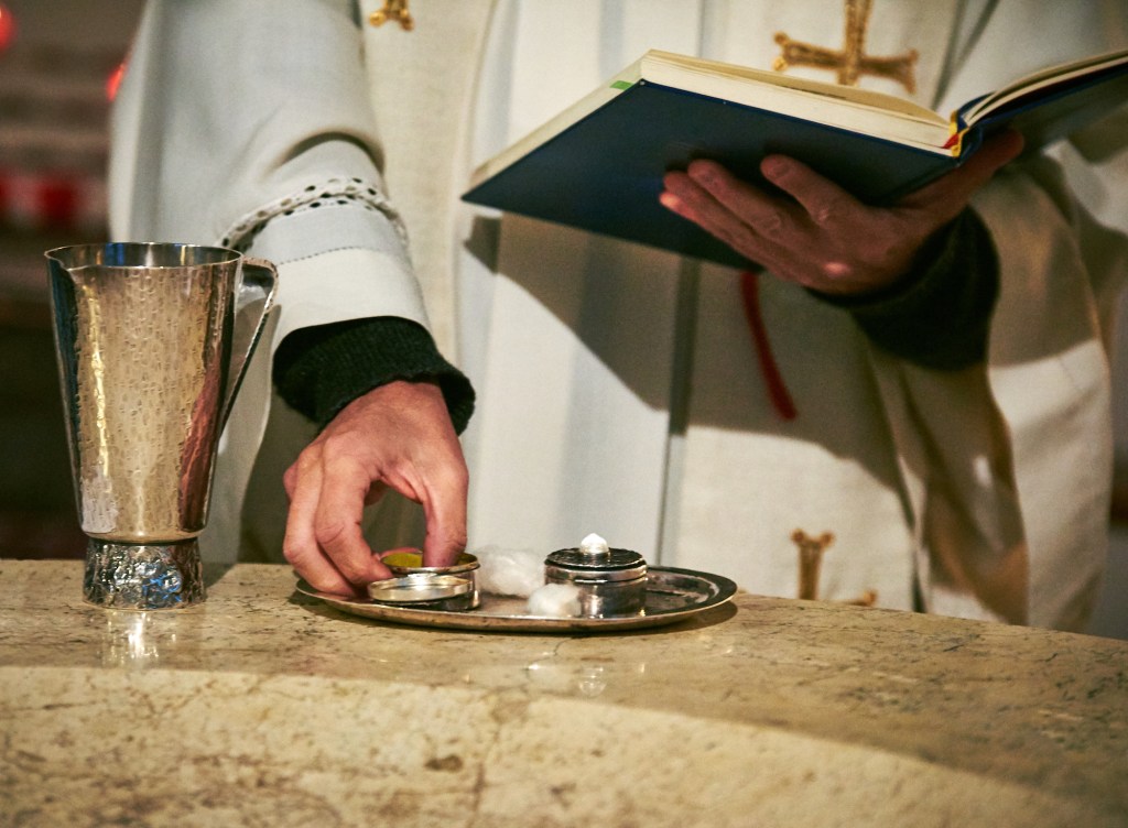 Catholic priest; eucharist; Bible