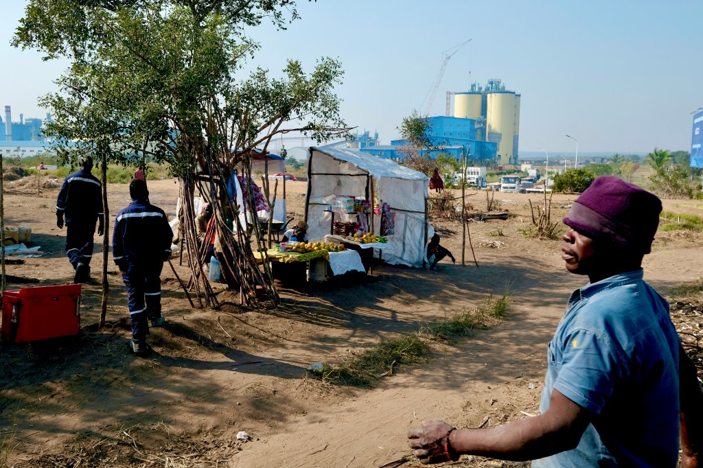 Workers at a Chinese-owned cement plant in Mozambique have been effectively imprisoned for a year.  Locals were displaced to build and operate the factory, and still live in temporary housing nearby.