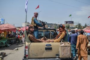 Taliban fighters on a pick-up truck move around a market area in Kabul on August 17, 2021, after Taliban seized control of the capital following the collapse of the Afghan government.