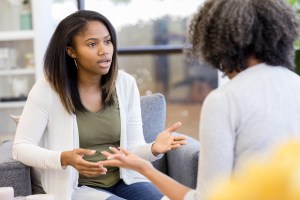 a young woman and her mother argue