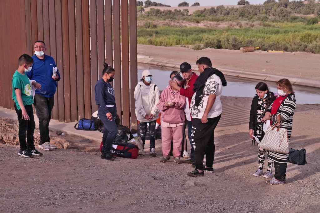 Migrants attempt to cross in to the U.S. from Mexico are later detained by U.S. Customs and Border Protection at the border August 16, 2021 in San Luis, Arizona.