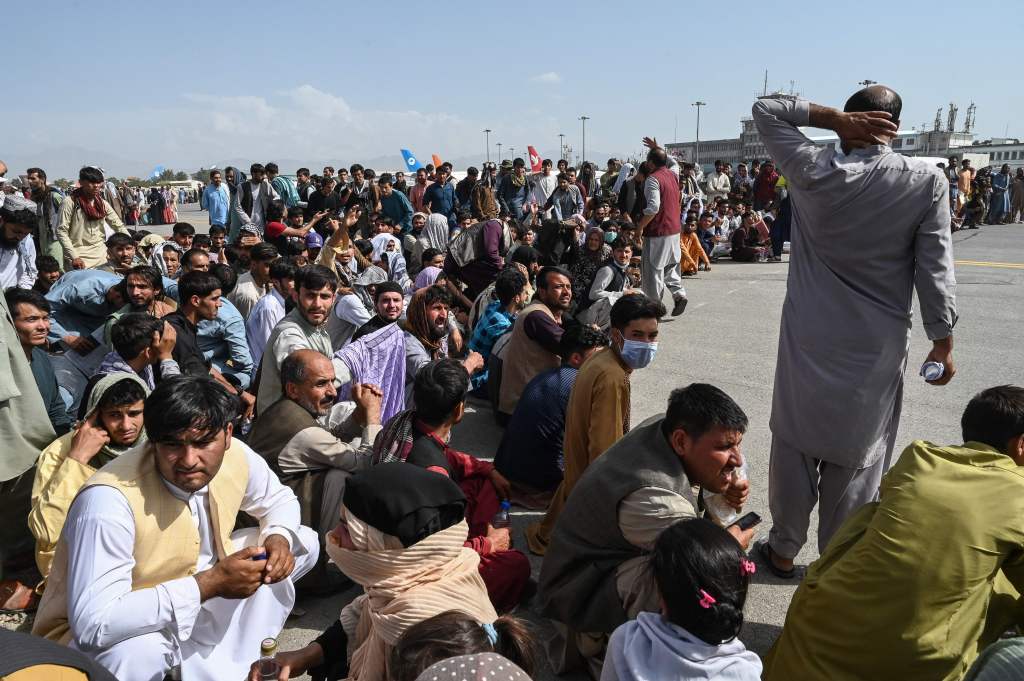 As refugee resettlement agencies ramp up to receive thousands of Afghan refugees, getting them visas and onto flights at the Kabul airport is proving difficult.