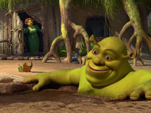 Shrek taking a mud bath while Fiona looks on.