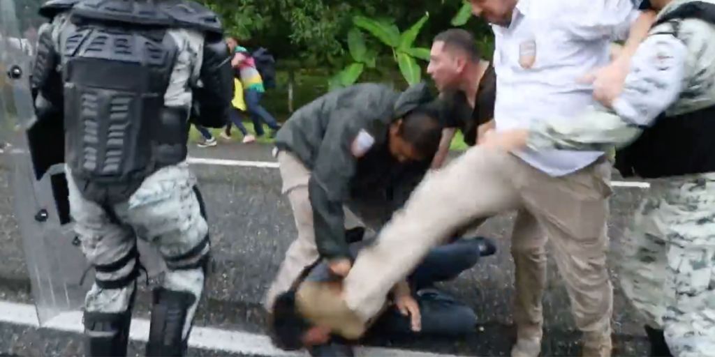 A screenshot from a video that shows an immigration official stomping on the head of a Central American migrant in southern Mexico over the weekend.