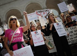 Activists participate in the 'Believe Survivors. STOP Kavanaugh.' rally hosted by TIME'S UP and others on September 28, 2018 in Los Angeles, California.