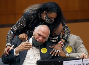 ose Grayson, niece of Francis DeSales Grayson, top, comforts James Grayson, son of Francis DeSales Grayson, left, and Rudy MCollum, great nephew of Francis DeSales Grayson, one of the Martinsville Seven, after Virginia Governor Ralph Northam issued posthu