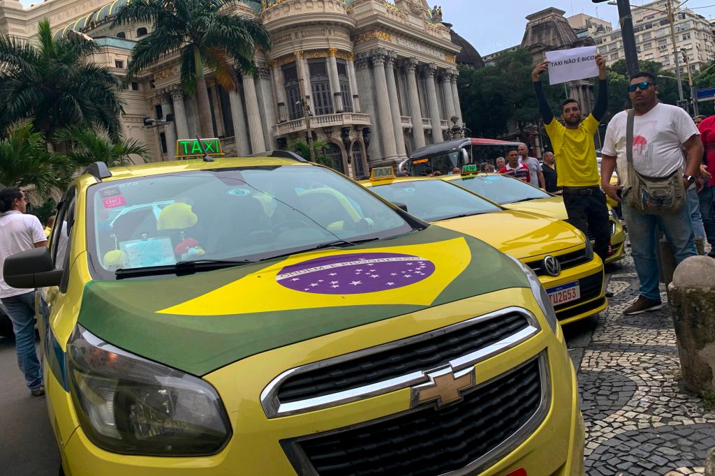 Taxi drivers protest in the street in Rio De Janeiro, Brazil