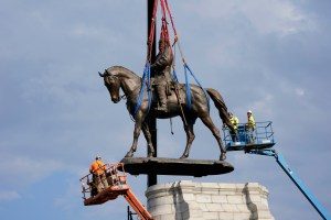 Crews remove a statue of Confederate General Robert E. Lee on Monument Avenue, September 8, 2021 in Richmond, Virginia.(Steve Helber - Pool/Getty Images)​