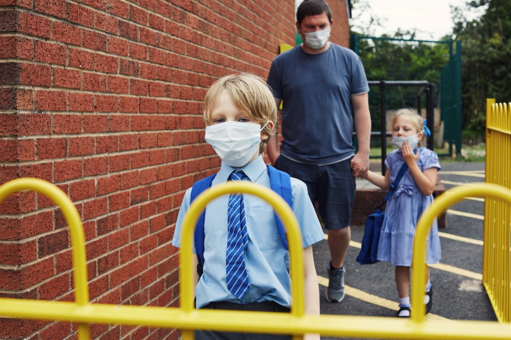 School children wearing masks.