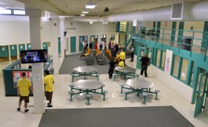 In this July 9, 2019 photo, clients gather in an open area at the Stonybrook Stabilization and Treatment Center at the Hampden County Correctional Center in Ludlow, Mass.