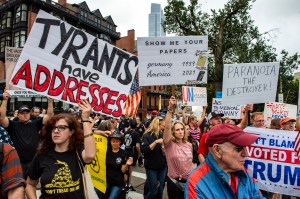 Demonstrators gather outside the Massachusetts State House in Boston to protest Covid-19 vaccination and mask mandates. (Photo by JOSEPH PREZIOSO / AFP) (Photo by JOSEPH PREZIOSO/AFP via Getty Images)