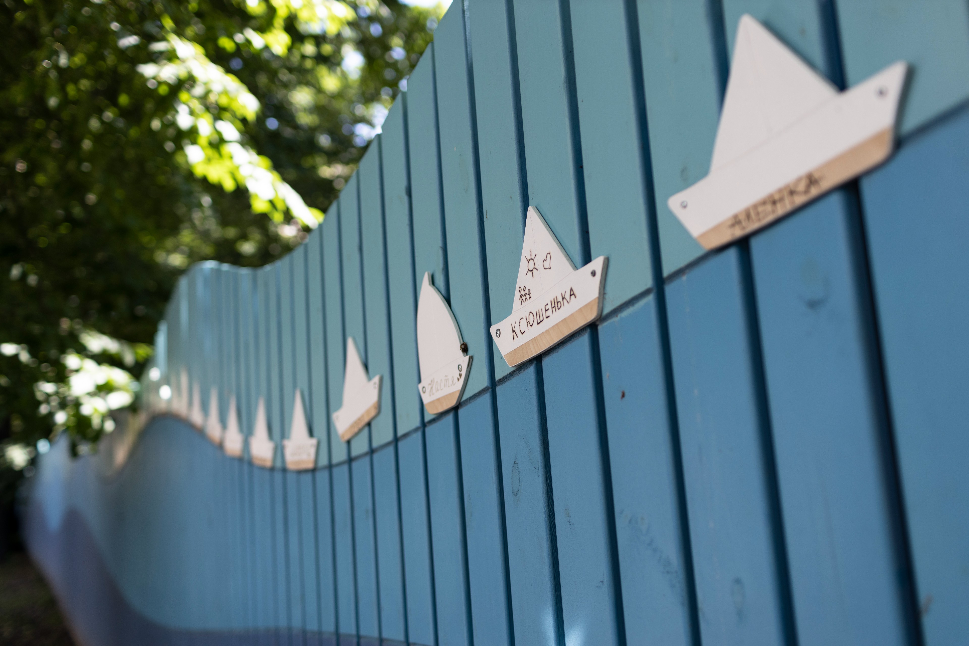 SIGNS WITH THE NAMES OF CHILDREN THAT HAVE DIED AT THE LIGHTHOUSE CHILDREN’S HOSPICE HANG ON A FENCE AT THE YARD OF THE HOSPICE.