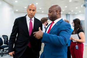 Sen. Tim Scott, R-S.C., right, and Sen. Cory Booker, D-N.J. talk as they wait for a Senate subway train on Capitol Hill in Washington, Friday, July 30, 2021.