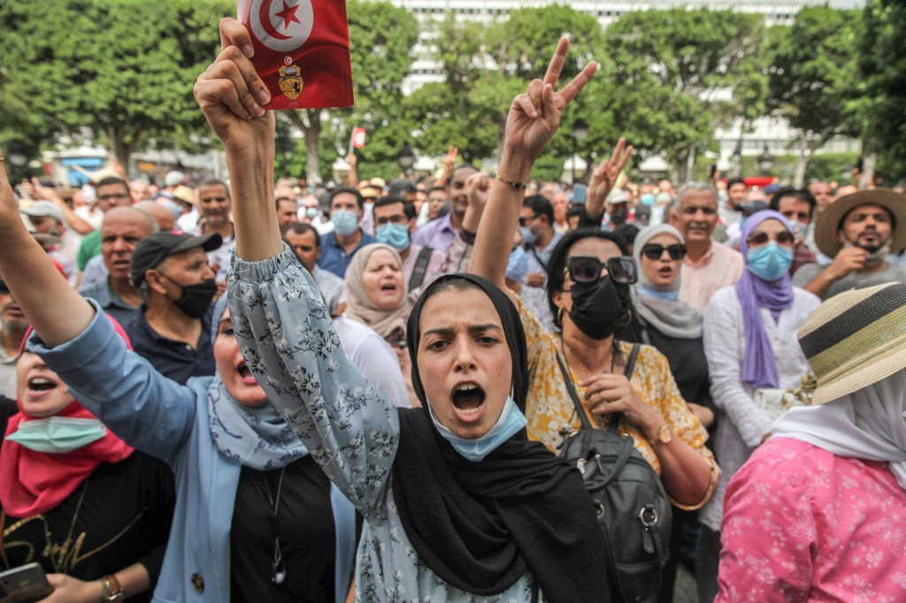 Protesters gather in Tunis against moves by the Tunisian president ​to suspend the constitution.