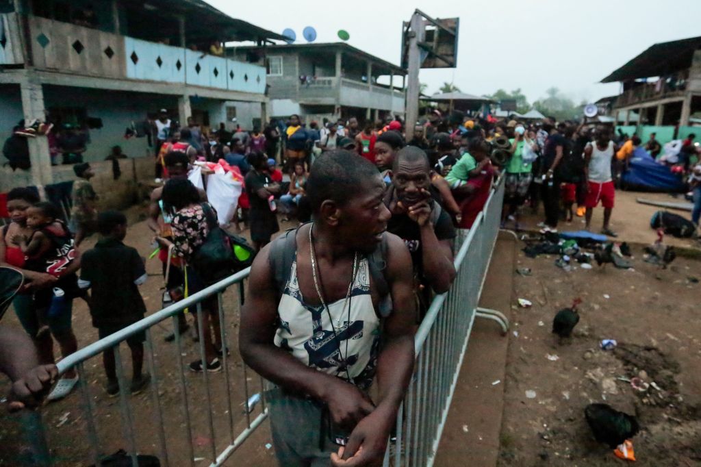 Migrants wait to be transported from Bajo Chiquito village to the Migrants Reception Station in Lajas Blancas, Darien Province, in Panama on August 23, 2021.