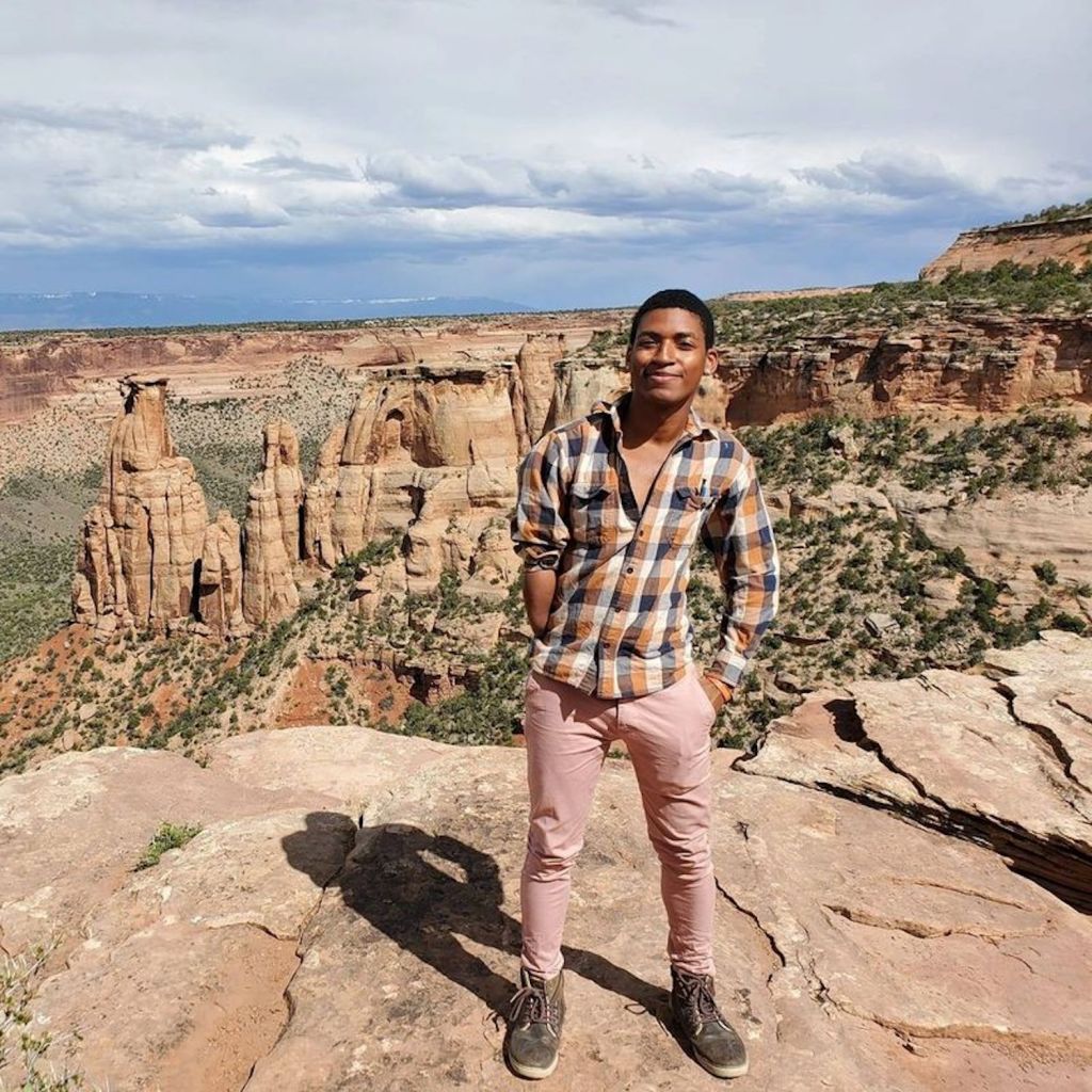 ​Daniel Robinson standing in desert